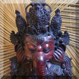 D19. Ganesh carved wood wall hanging. 